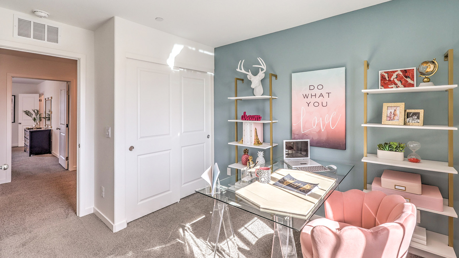 Bedroom Three in our Symmetry Trails 1309 model with carpet flooring, a sliding closet and one window.