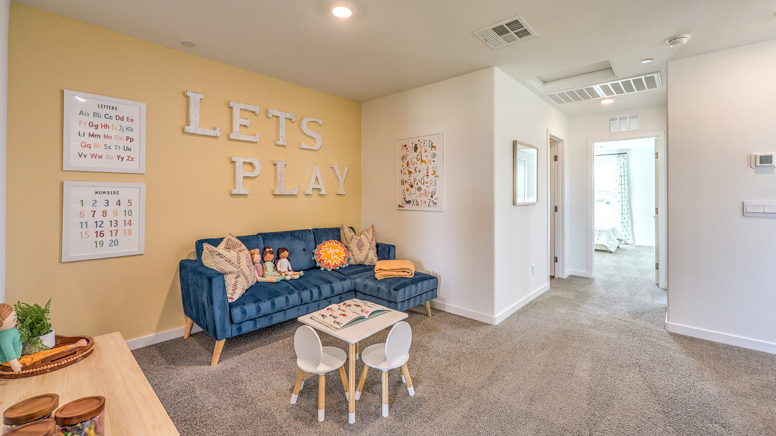 The upstairs loft in our Symmetry Trails 1410 model with carpet flooring.