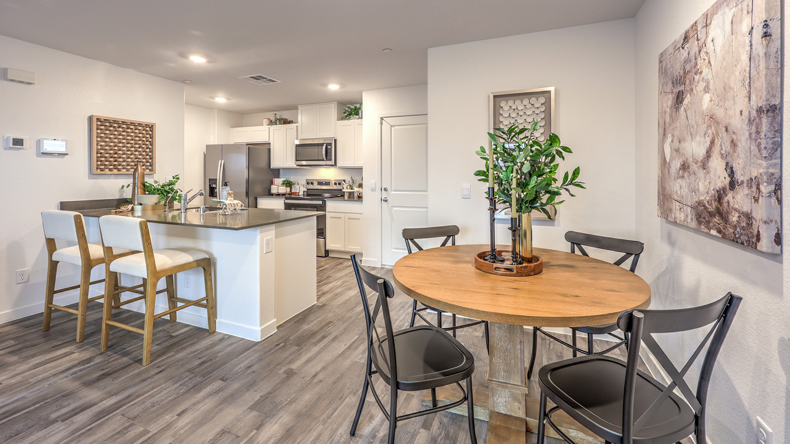 The Alpine Trails  1309 model Dining Room adjacent to the kitchen with a table and window.