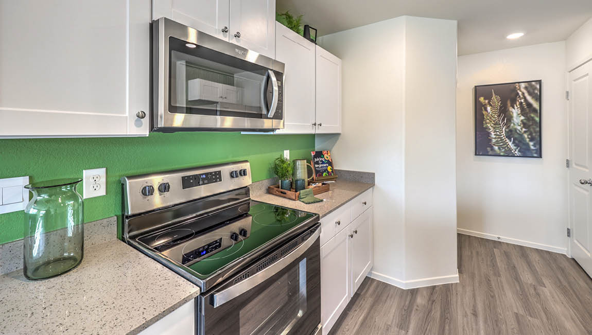 The Whirlpool Stainless steel microwave and range in our 1171 model kitchen.
