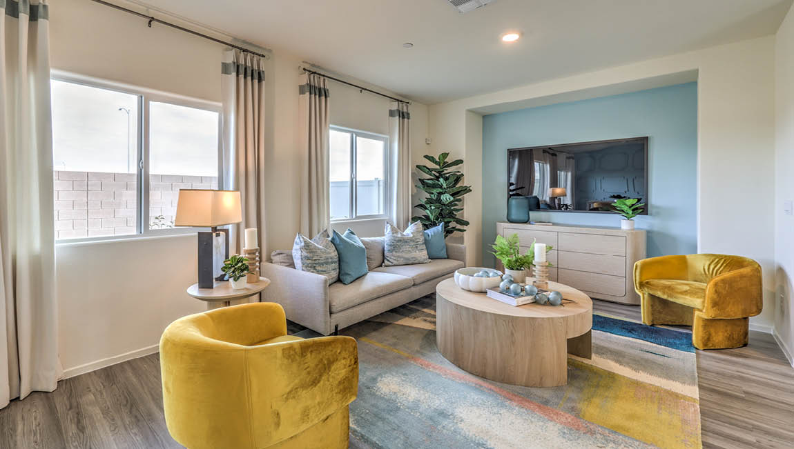 The Juno Pointe 1349 Plan open concept Great Room with LVP flooring and large windows.