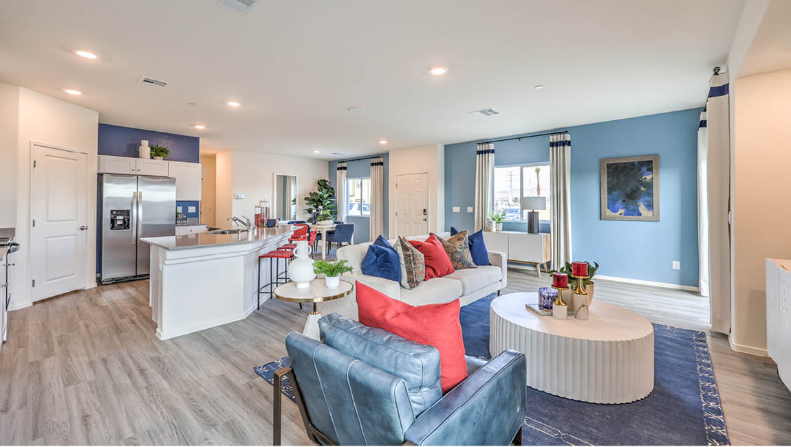 The Juno Pointe 1600 Plan open concept Great Room with LVP flooring and large windows.