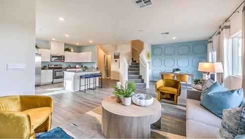 The Juno Pointe 1349 Plan open concept Great Room with a view of the kitchen.