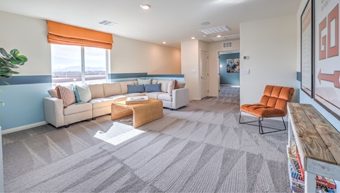 The upstairs loft in our 3000 model with carpet flooring and large windows.