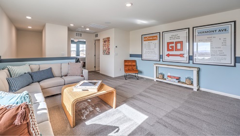 The upstairs loft in our 3000 model with carpet flooring and large windows.