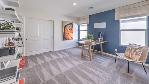 The Office/Bedroom Two option in our Heartland Falls 3000 model with carpet flooring, furnished with a desk and chair.