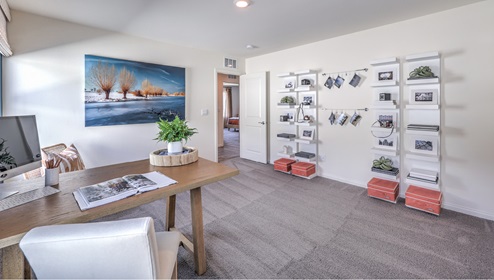 The Office/Bedroom Two option in our Heartland Falls 3000 model with carpet flooring, furnished with a desk and chair.