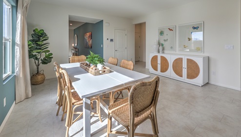 The Heartland Falls 3000 model Dining Room adjacent to the kitchen with a table and window.