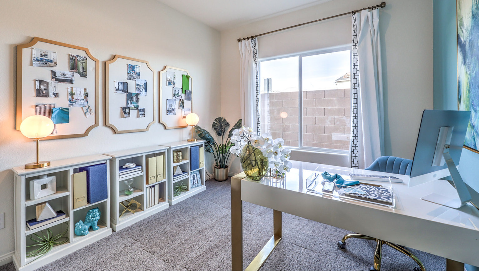 The Office/Bedroom Five option in our Heartland Falls 2600 model with carpet flooring and a sliding closet, furnished with a desk and chair.