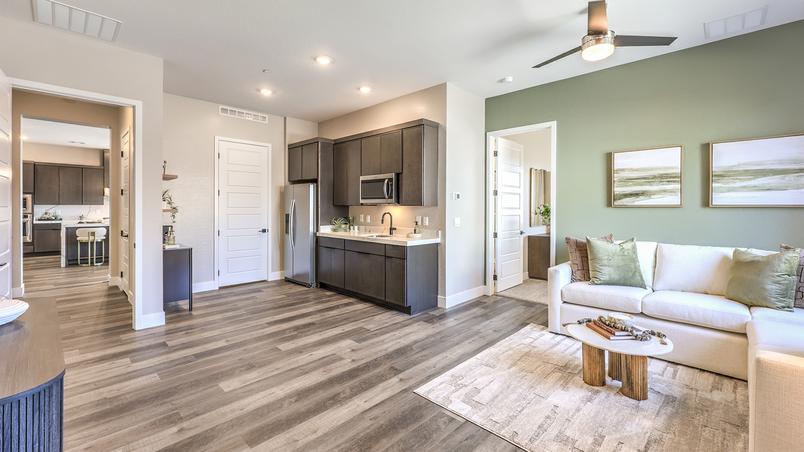 Our Heartland Summit 4418 Multigen Suite with a kitchenette, laundry room, and living area.