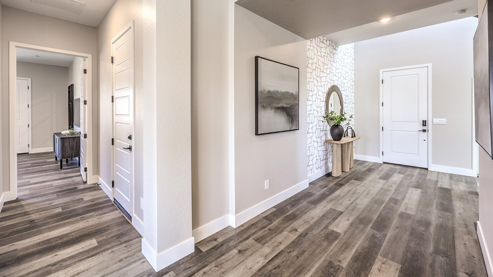 The front door entrance to our Heartland Summit 4418 model with Luxury Vinyl Plank Flooring