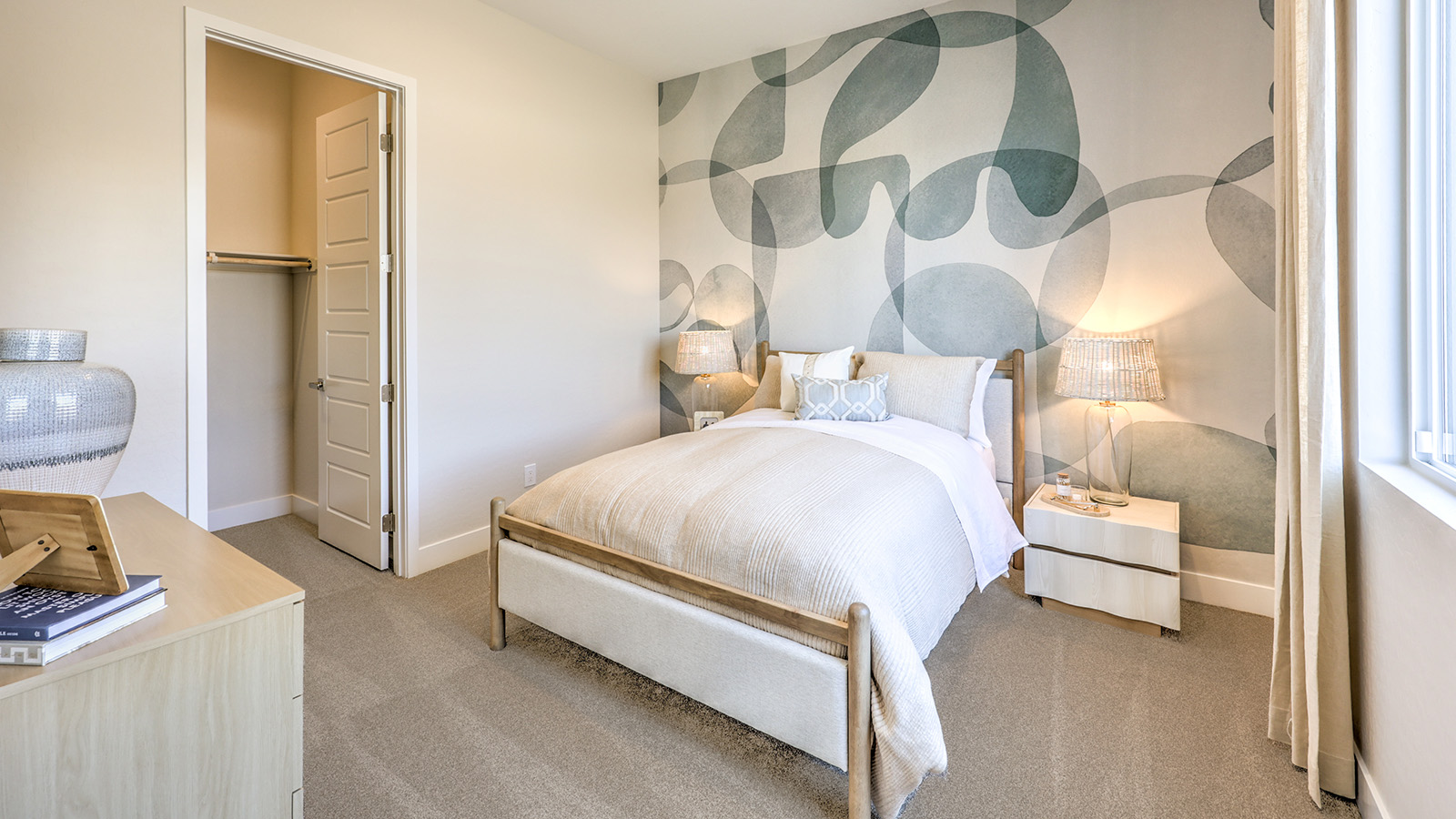 Bedroom Five in our Heartland Summit 3765 Multigen Suite with carpet flooring, a walk-in closet, and a window.