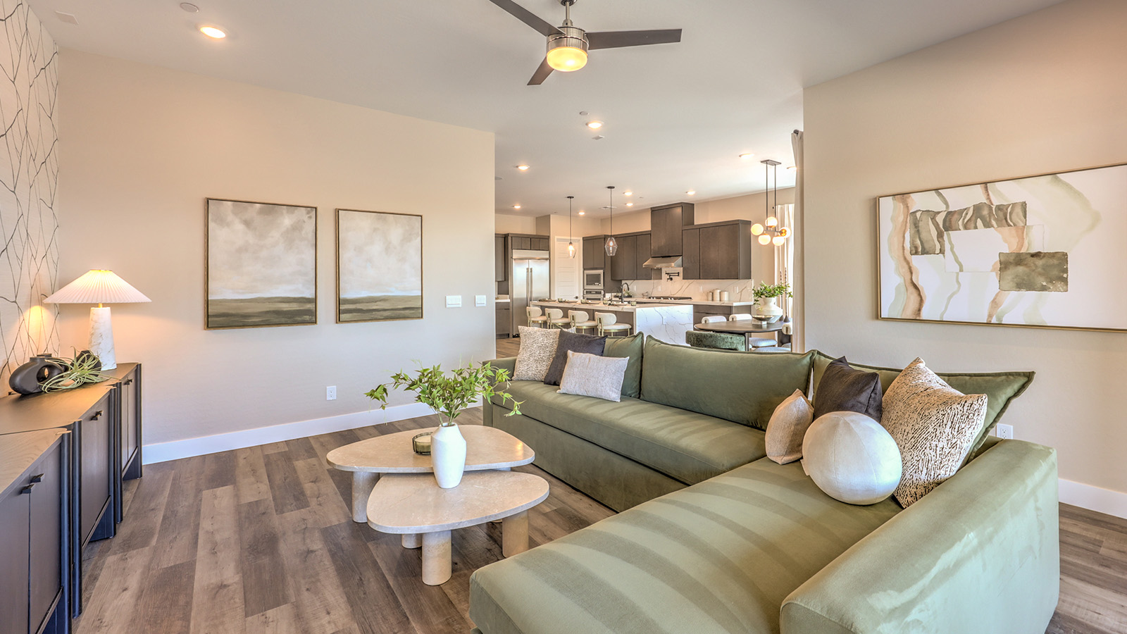 The Heartland Summit 4418 Plan open concept Great Room with Luxury Vinyl Plank Flooring and large windows.