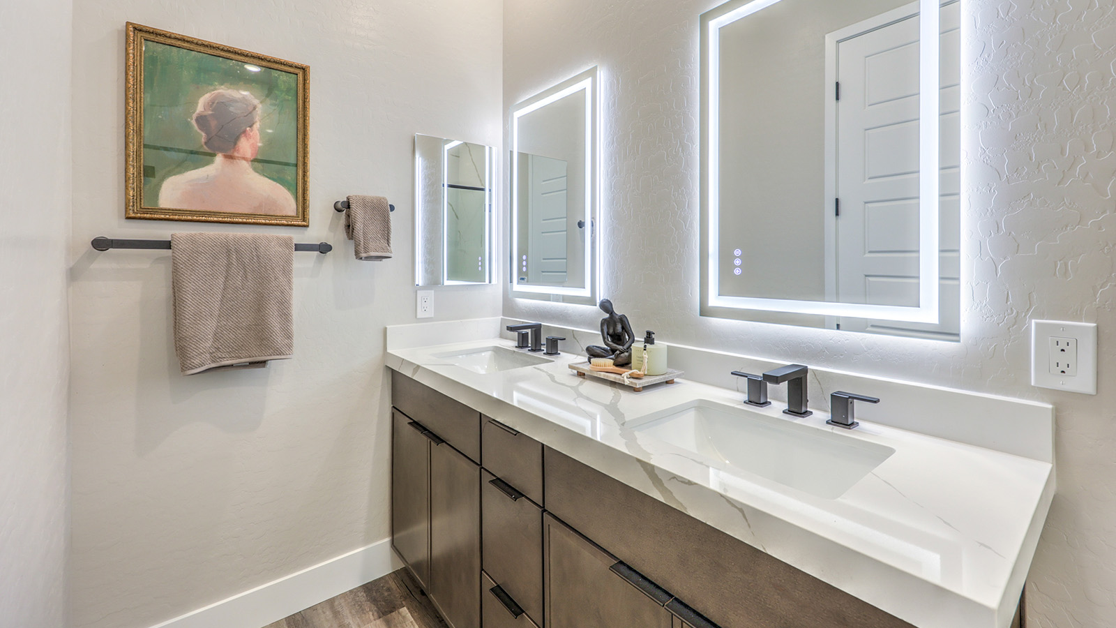 Bathroom Four in our Heartland Summit 4418 Multigen Suite with granite countertops at the Bath Vanity, a walk-in shower, mirror, and brown cabinets.