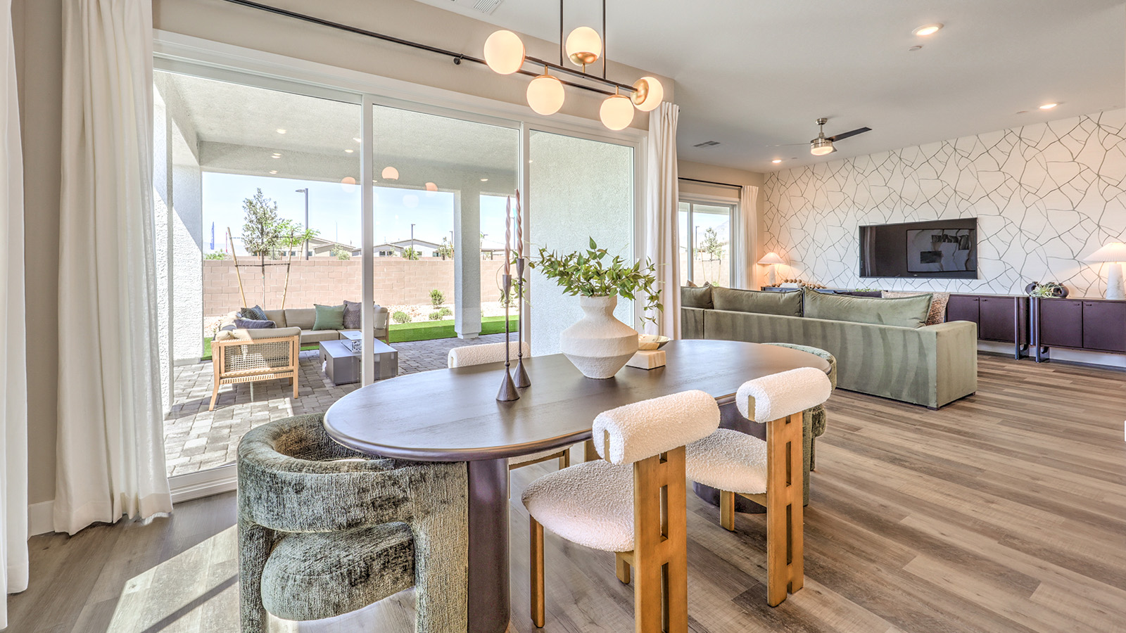 The Heartland Summit 4418 model Dining Room adjacent to the kitchen and great room with a table and large window.
