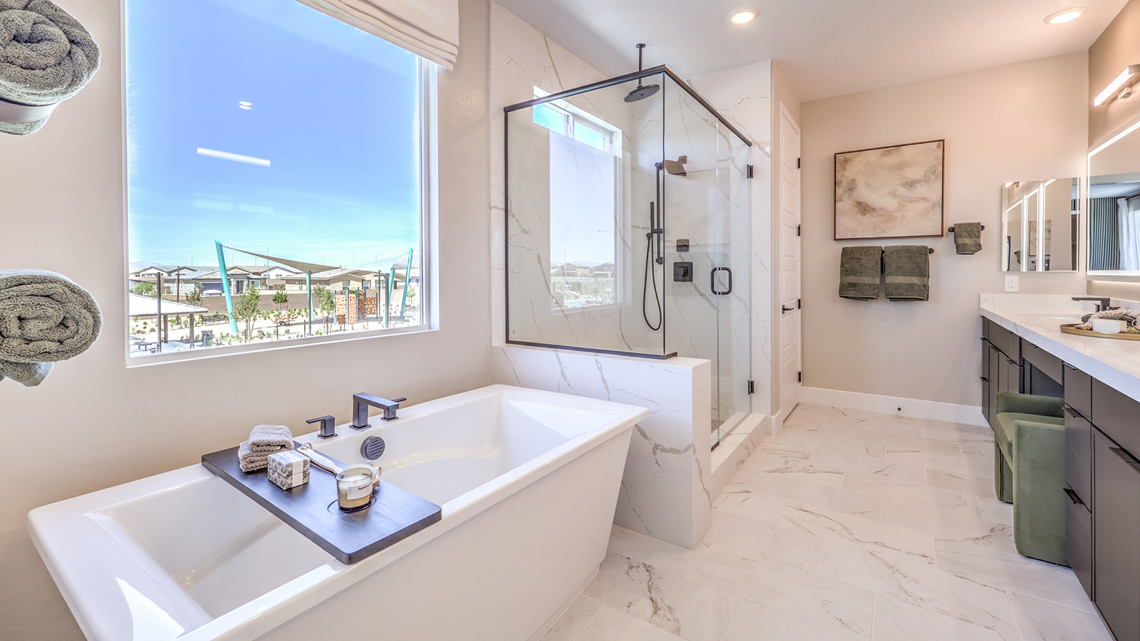 Attached to the Bedroom One Suite, our 4418 model bathroom with granite countertops at the double Bath Vanity, a walk-in closet, mirror, and brown cabinets.
