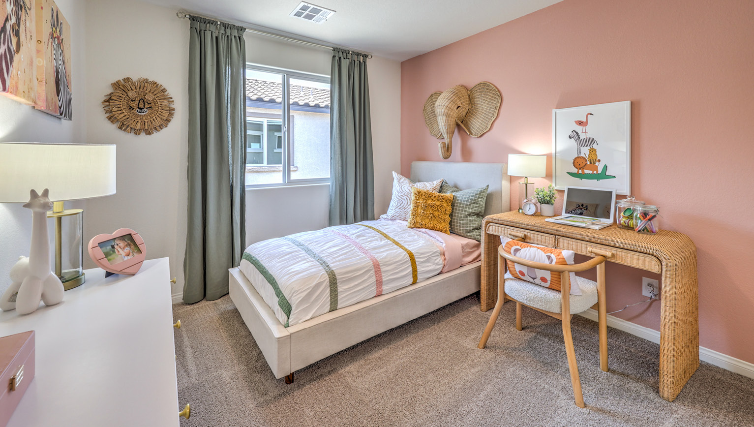 Bedroom Two in our Heartland Bay 1865 model with carpet flooring, a sliding closet, and one window.