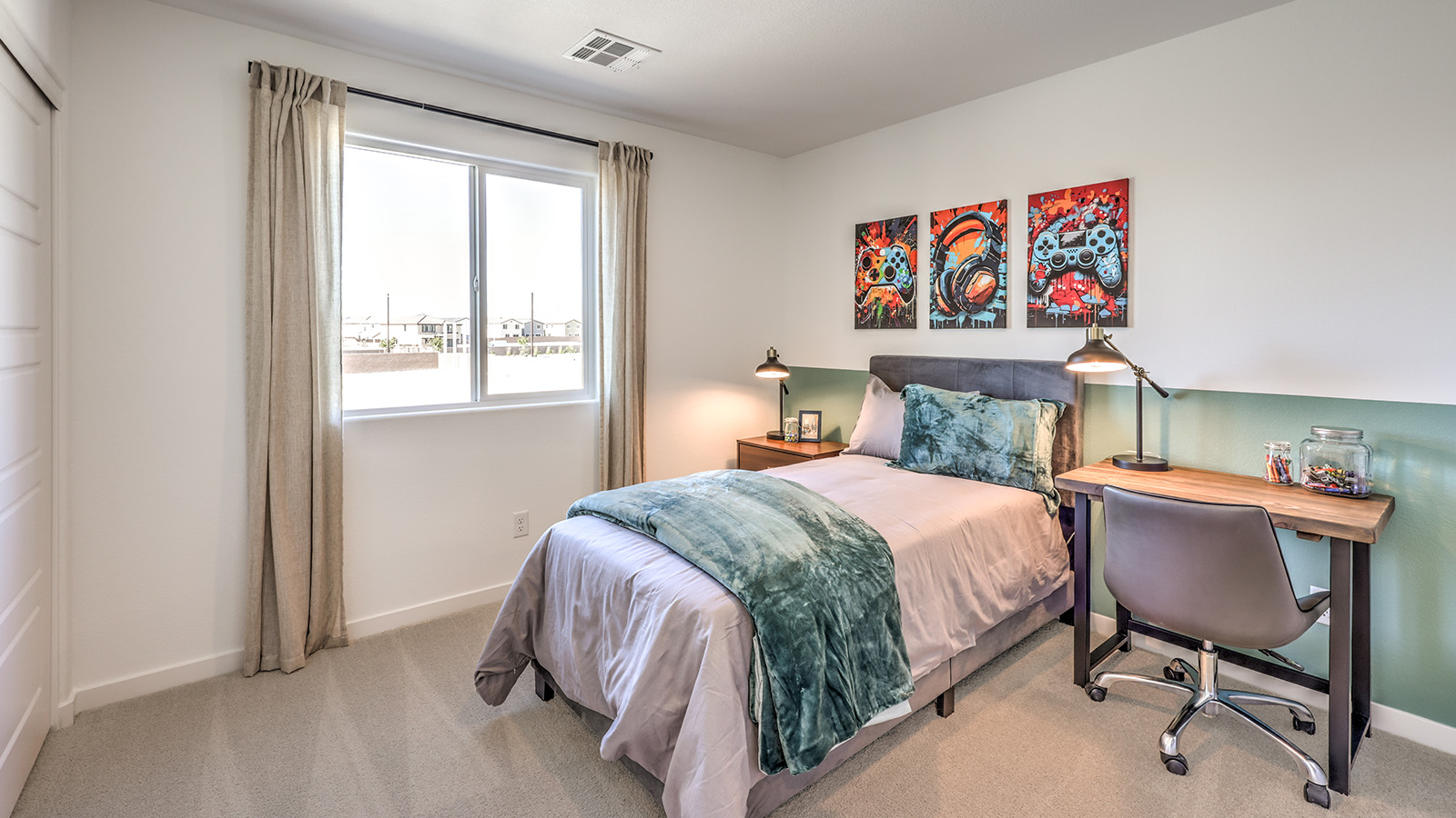 Bedroom Two in our Heartland Bay 1802 model with carpet flooring, a sliding closet, and one window.