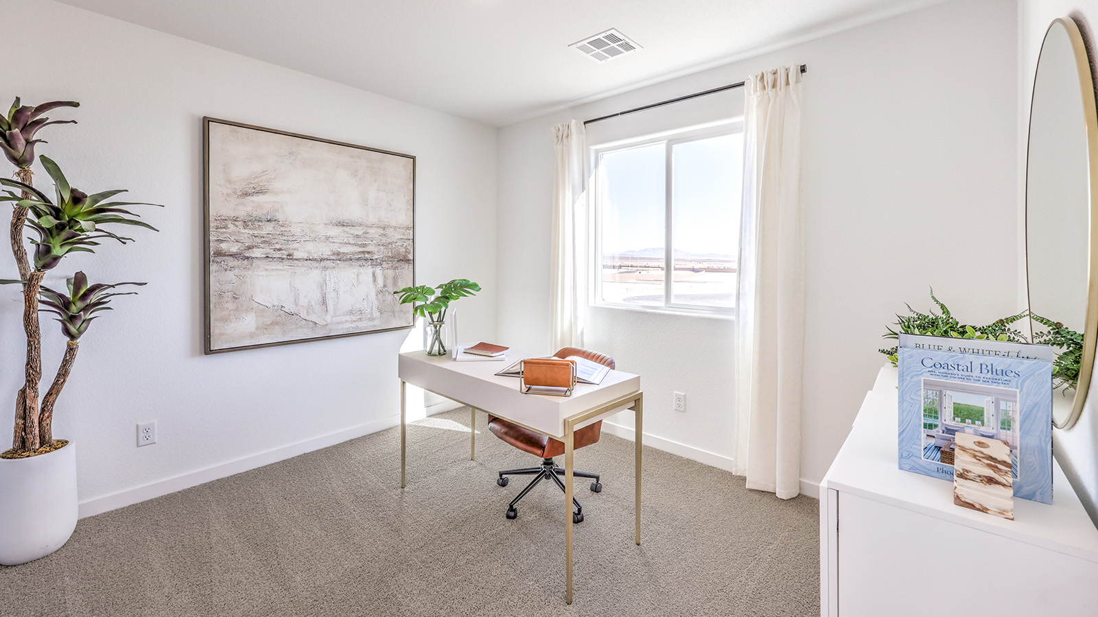 The Office/Bedroom Four option in our Heartland Bay 1872 model with carpet flooring, a sliding closet, and a window, furnished with a desk and chair.