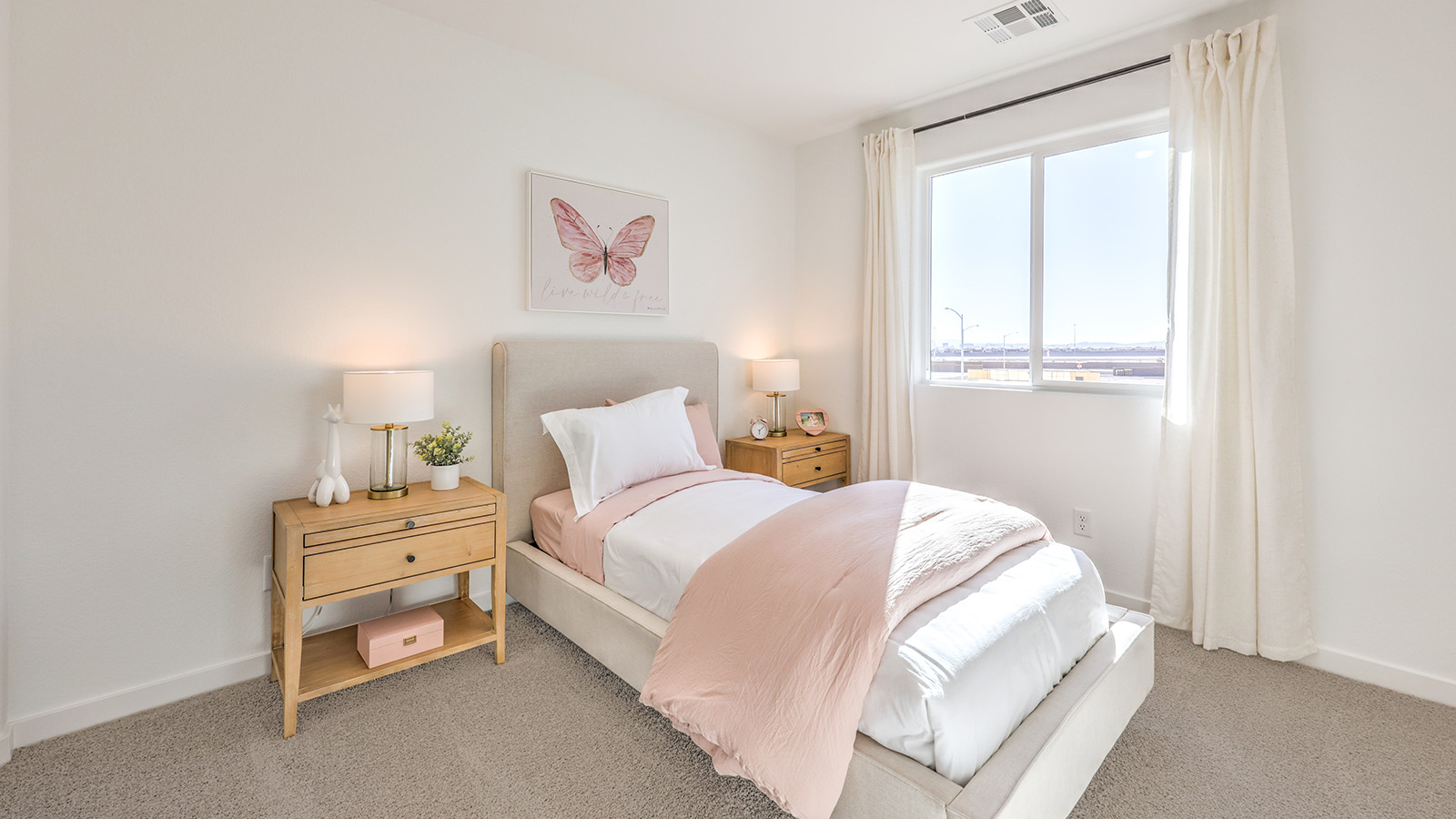 Bedroom Three in our Heartland Bay 1872 model with carpet flooring, a sliding closet, and one window.