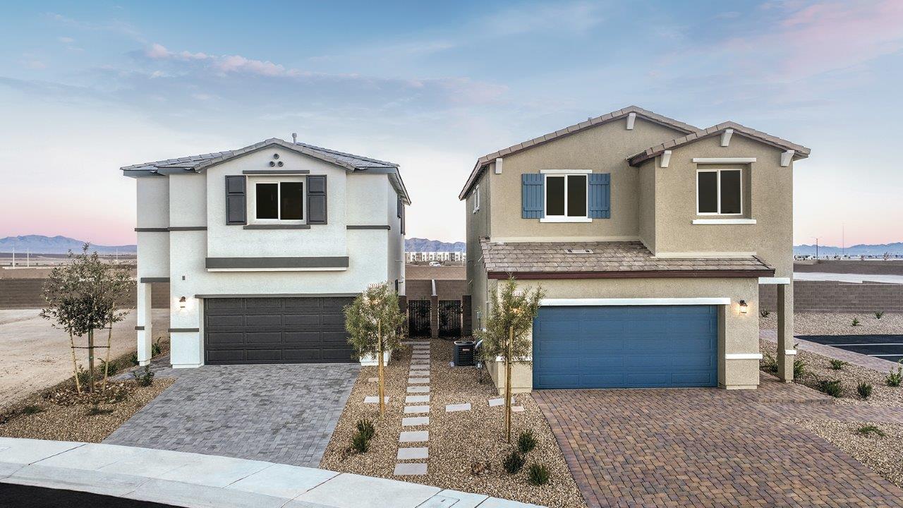 Exteriors in our Heartland Bay Community featuring front yard landscaping, paver driveways, and two-car garages.