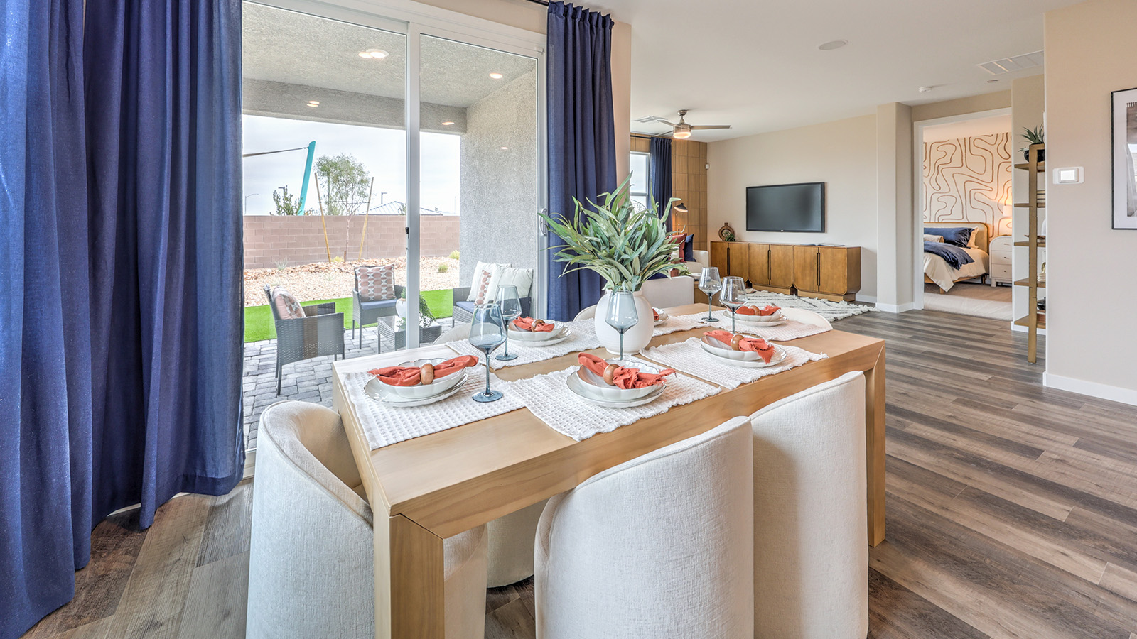 The Heartland Grove 1839 model Dining Room adjacent to the kitchen with a table and two windows.