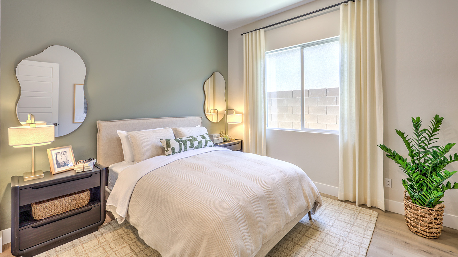 The MultiGEN bedroom in our Heartland Manor 2754 Plan features plush carpet flooring, a spacious layout, and a large window that fills the room with natural light. Designed for comfort and privacy, this bedroom is part of the MultiGEN suite, offering a flexible living space for multi-generational households.