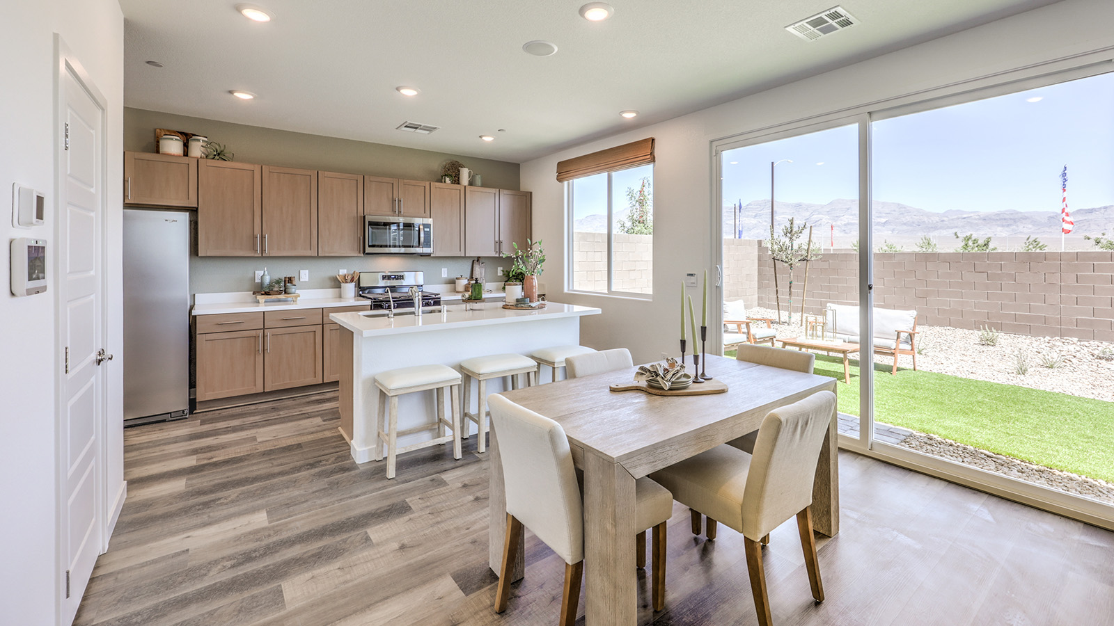 The Heartland Cottages 1700 model Dining Room adjacent to the kitchen with a table and window.