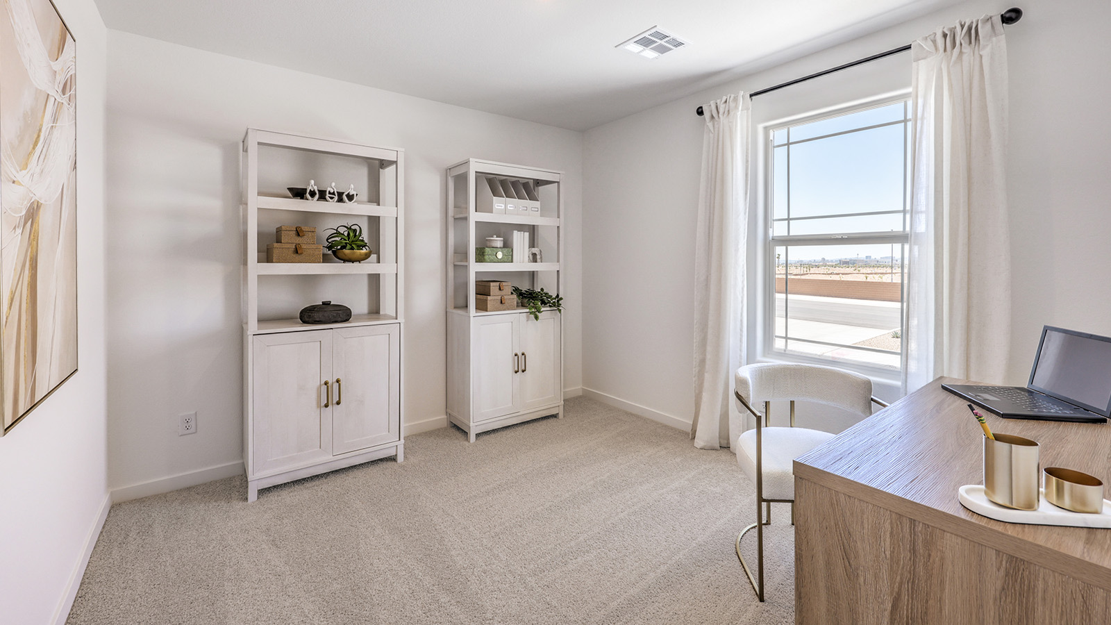 The Office/Bedroom Four option in our Heartland Cottage 1865 model with carpet flooring, a sliding closet, and a window, furnished with a desk and chair.
