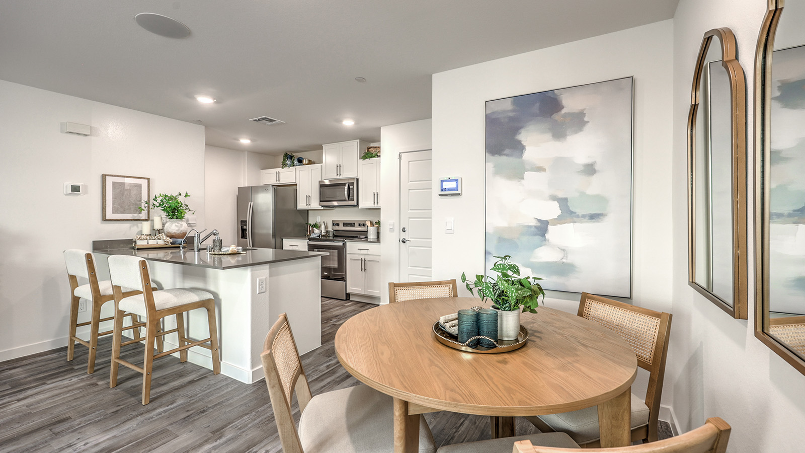 The Canyon Trails  1309 model Dining Room adjacent to the kitchen with a table and window.