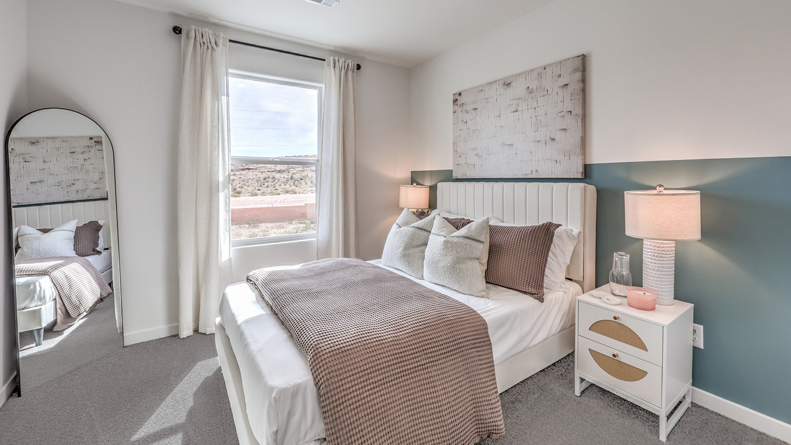 Bedroom Three in our Canyon Trails  1309 model with carpet flooring, a sliding closet and one window.