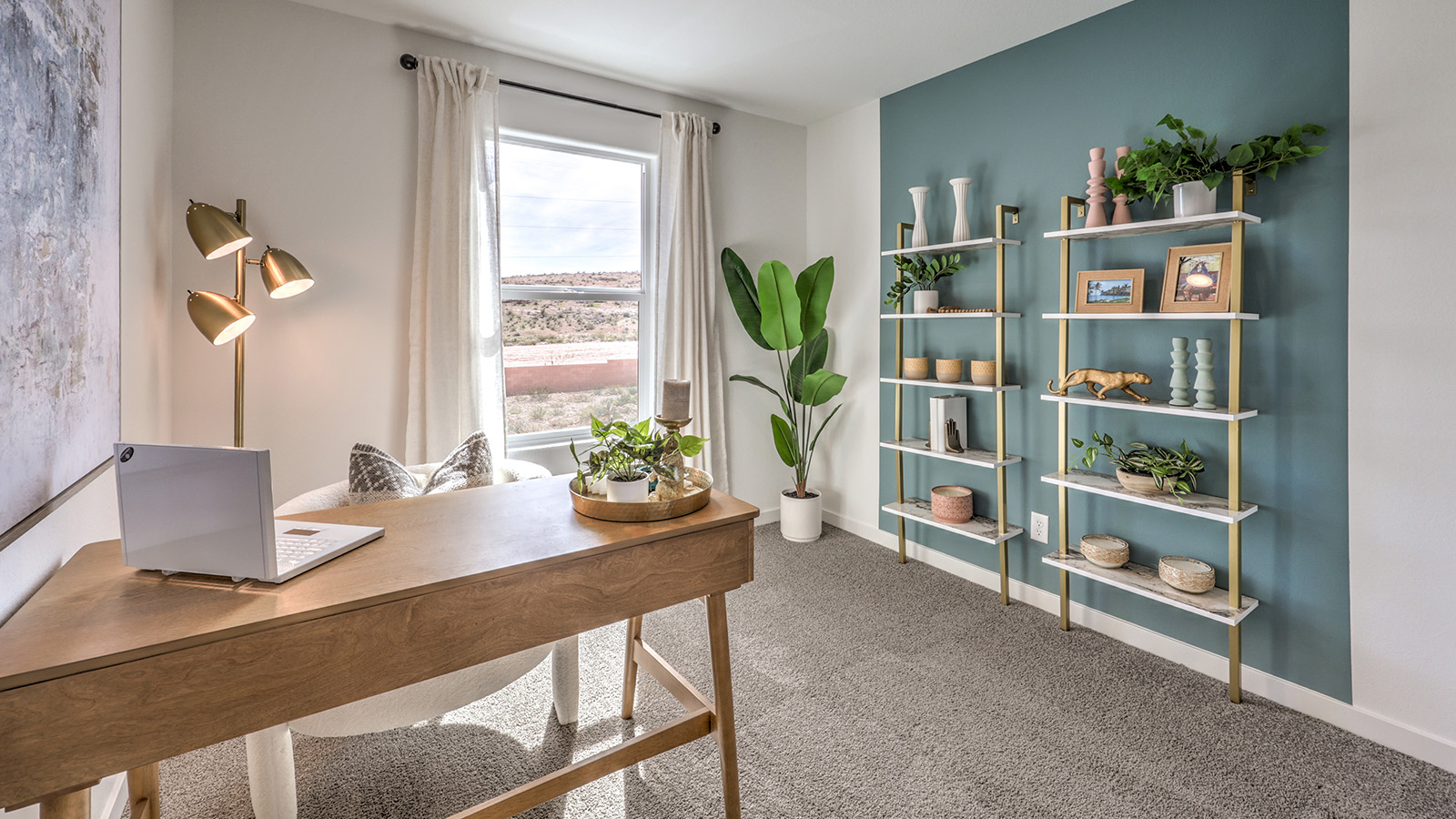 The Office/Bedroom Two option in our Canyon Trails 1309 model with carpet flooring and a window, furnished with a desk and chair.