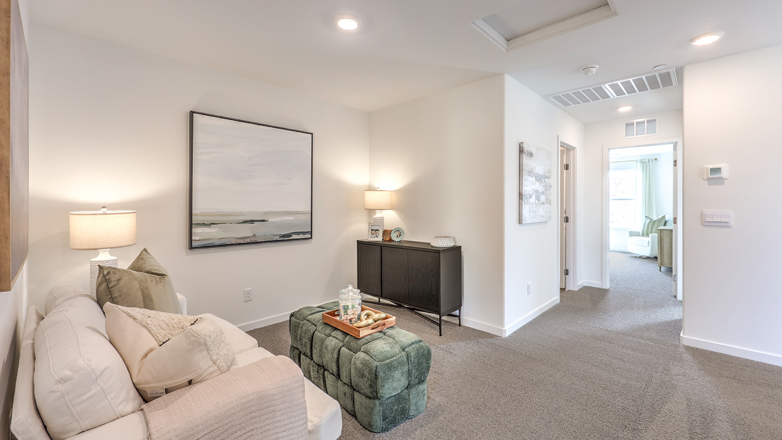 The upstairs loft in our Canyon Trails 1410 model with carpet flooring and a closet.