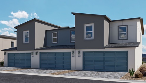 Our 1309 model home in the Kalea Trails community with a paver driveway and walkway, a 2-car garage, and lighted address numbers.