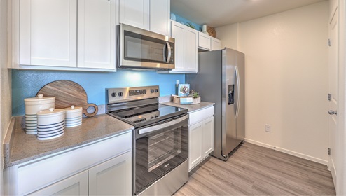 Kalea Trails includes a refrigerator, stainless steel appliances that include micorwave, stove top and oven, and dishwasher. Our kitchen has storage space above the stove and refrigerator as well as below the sink. This kitchen also includes a pantry.
