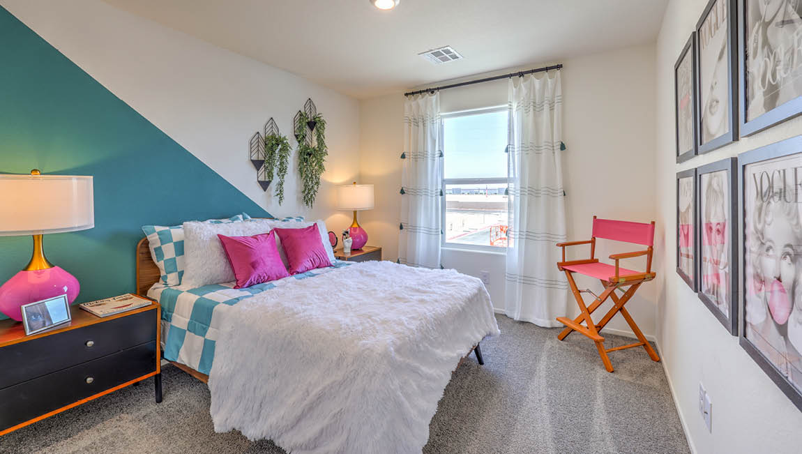 Bedroom Three in our Kalea Trails 1430 model with carpet flooring and one window.