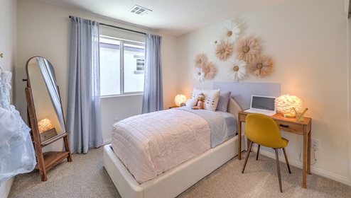 The third bedroom is decorated as a little girls room. Spacious enough for a twin sized bed and desk with windows for natural light