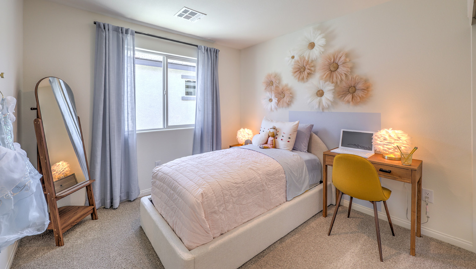 Bedroom Three in our Kalea Bay 1865 model with carpet flooring, a sliding closet, and one window.