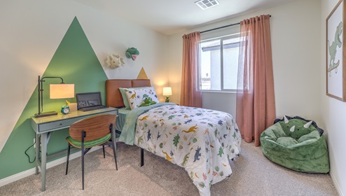The fourth bedroom is decorated as a little boys room. Spacious enough for a twin sized bed and desk and has a large window for natural light