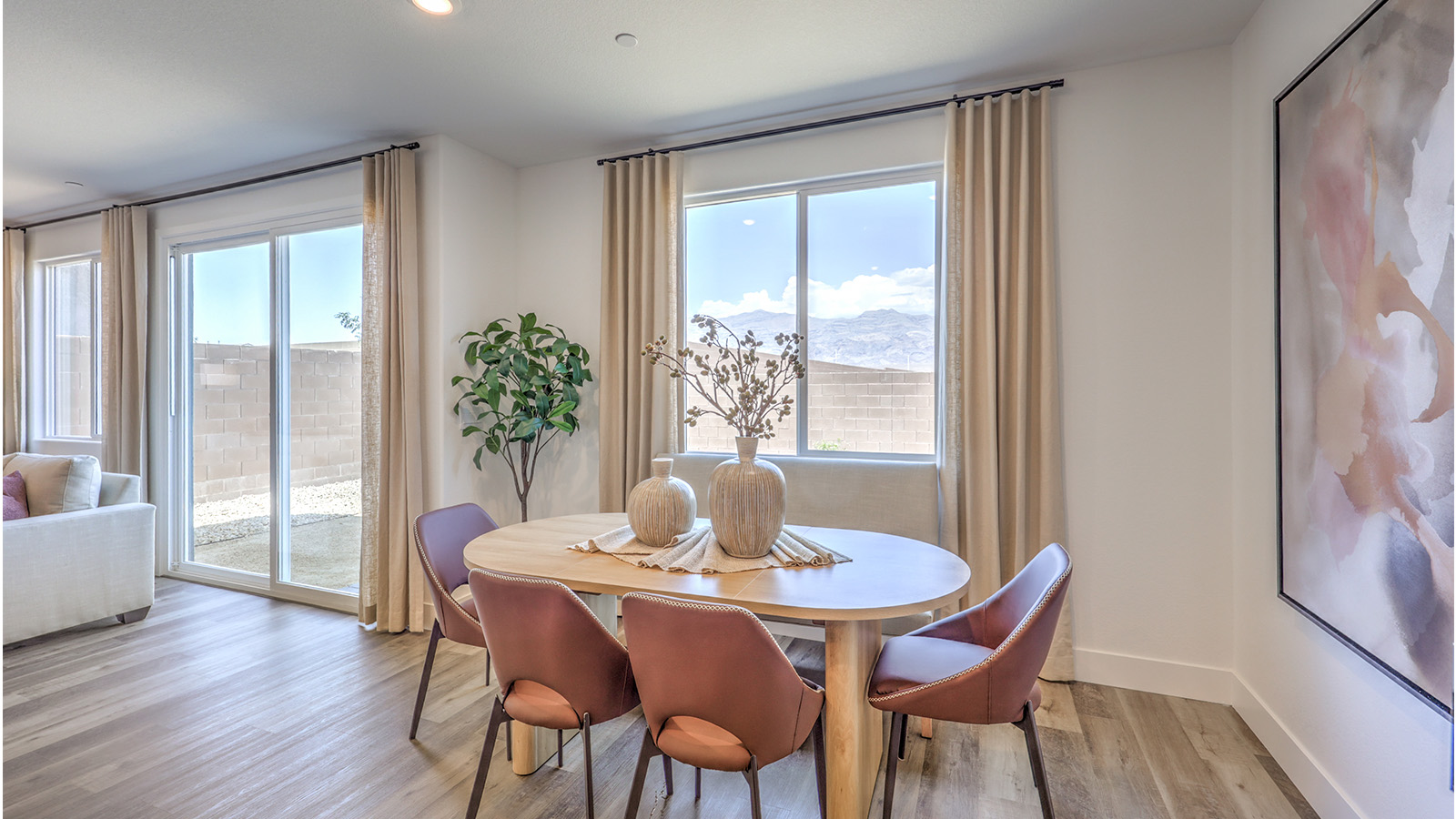 The Heartland Falls 2660 model Dining Room adjacent to the kitchen with a table and window.