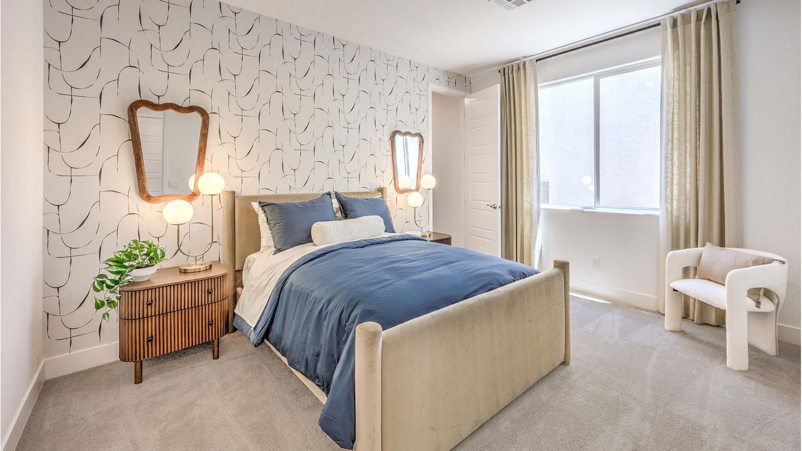 Bedroom Three in our Heartland Falls 3000  model with carpet flooring, a sliding closet, and a window.