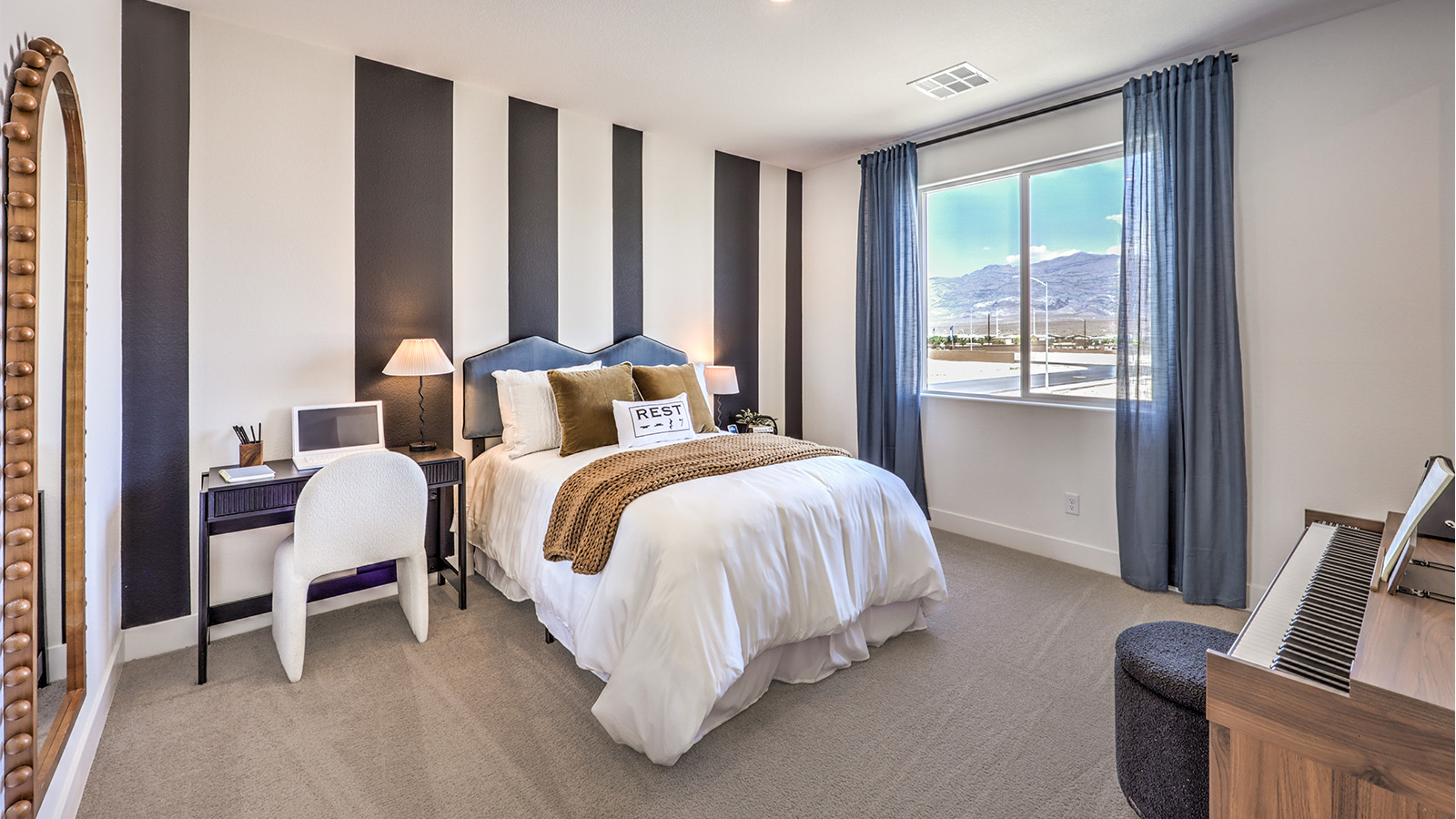 Bedroom Four in our Heartland Falls 3000  model with carpet flooring, a sliding closet, and a window.