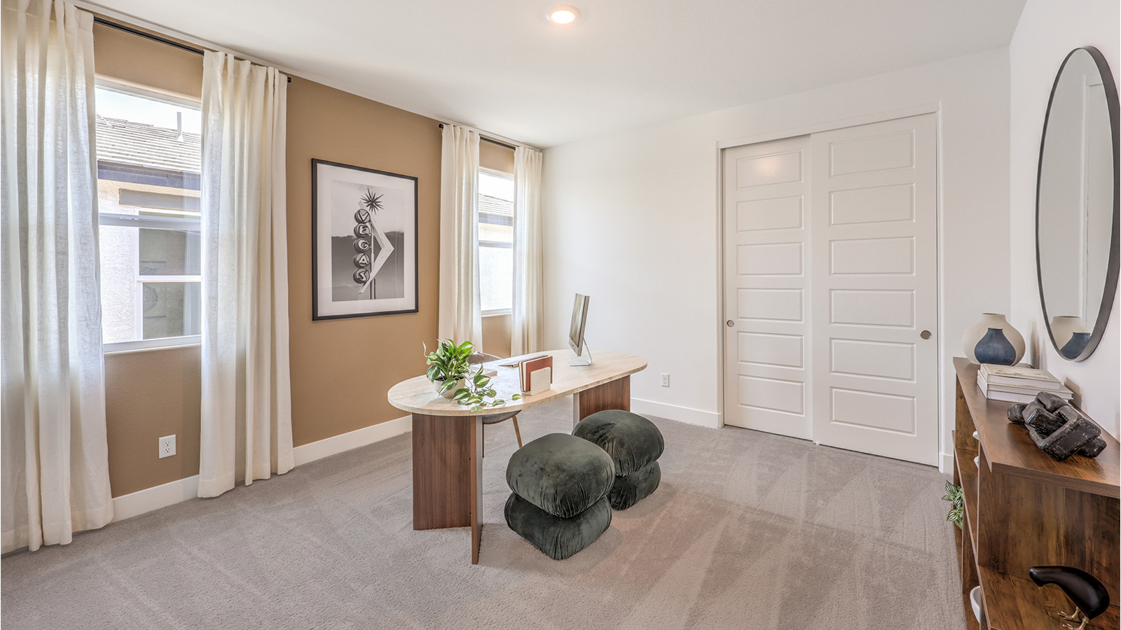 Bedroom Three in our Heartland Falls 3000  model with carpet flooring, a sliding closet, and a window.
