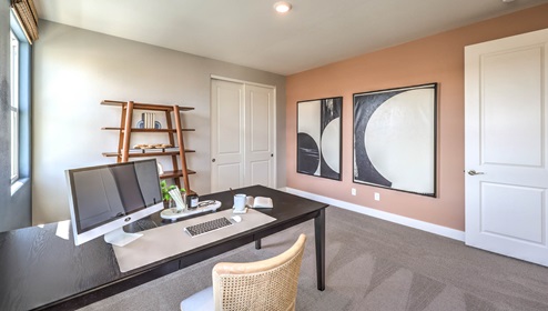 The fourth bedroom in our Heartland Falls 3001 Plan features plush carpet flooring, a spacious layout, and a large window for natural light. With a standard closet and ample space, this versatile room can be used as a bedroom or a home office to fit your needs.