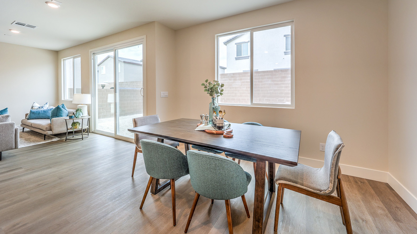 The Heartland Falls 2660 model Dining Room adjacent to the kitchen with a table and window.