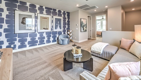 The upstairs loft in our 3001 model with carpet flooring and large windows.