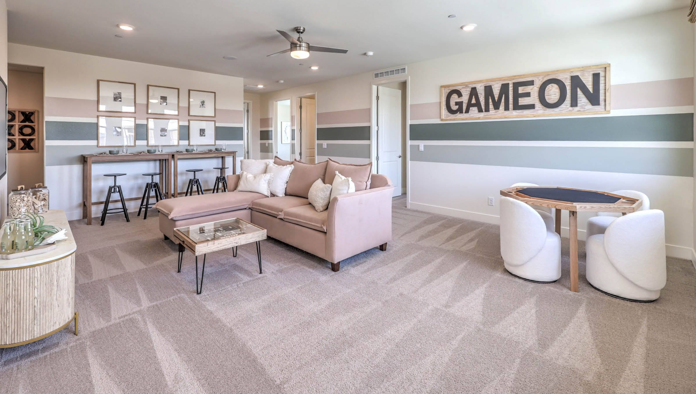 The upstairs loft in our 4425 model with carpet flooring and large windows.