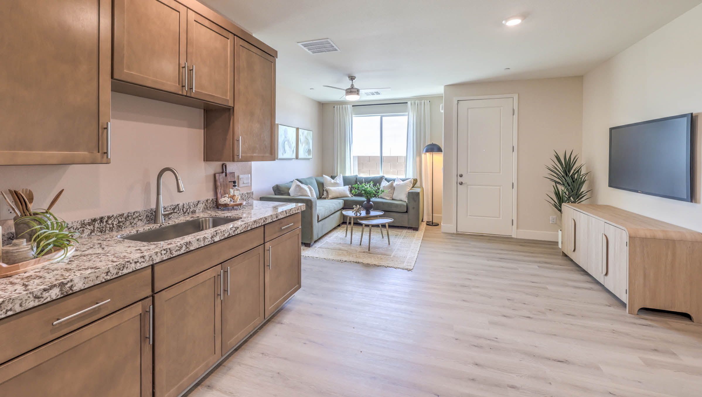Our Heartland Summit 4425 Multigen Suite with a kitchenette, laundry room, and living area.