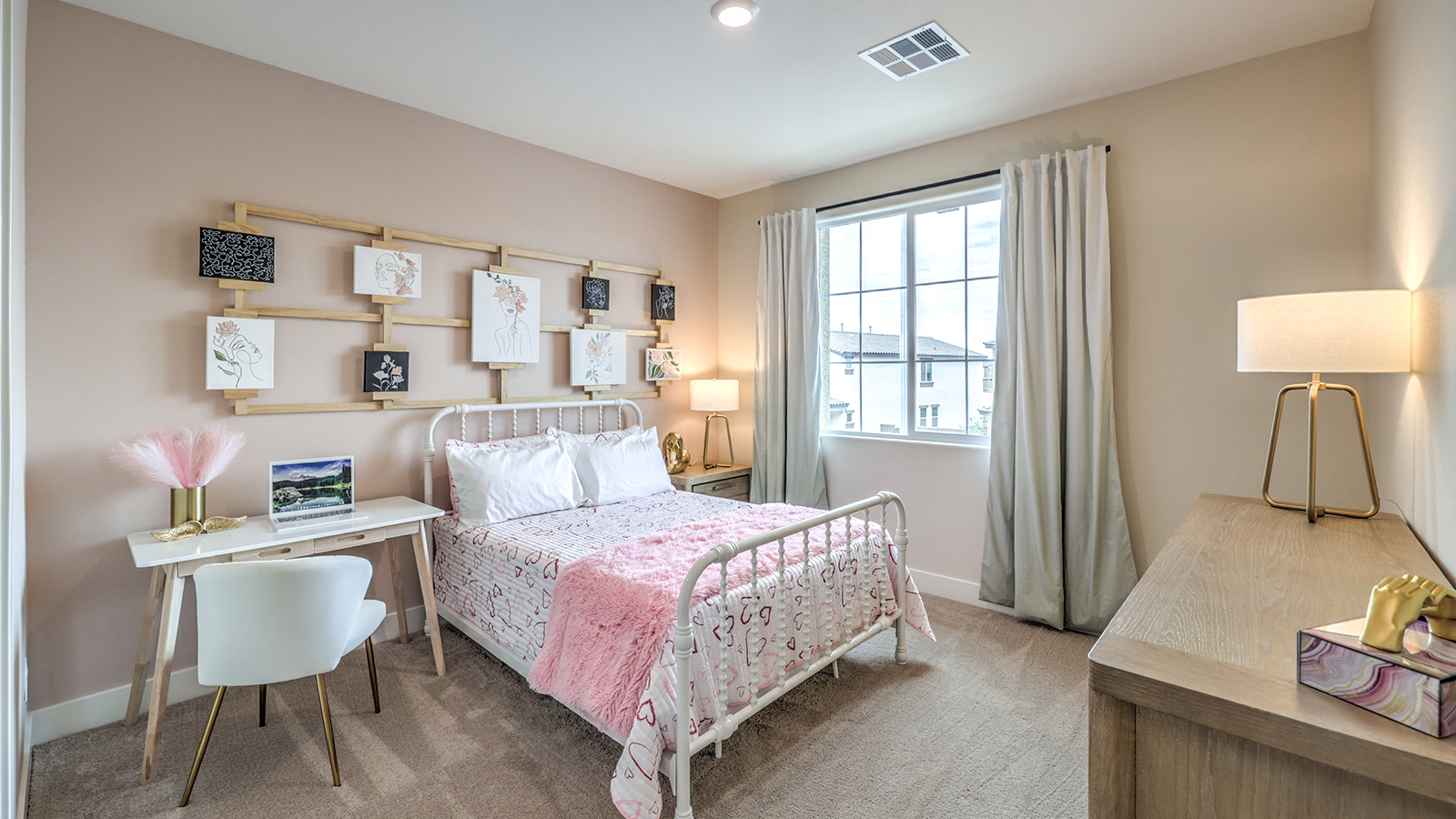 Bedroom Two in our Heartland Summit 4425 model with carpet flooring, a walk-in closet, and a window.