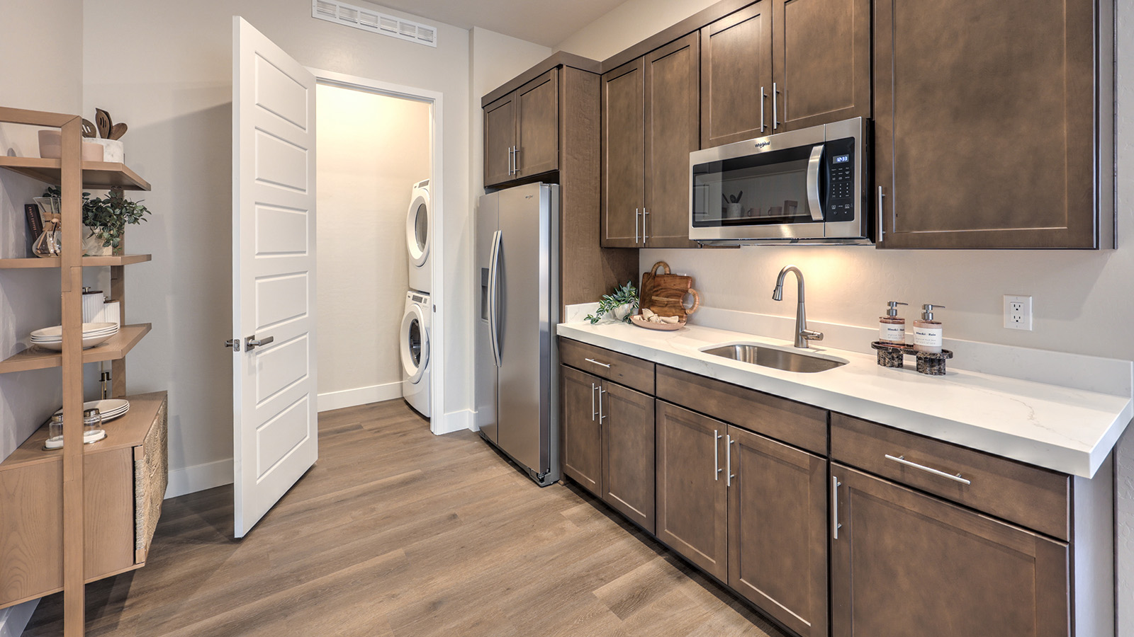 Our Heartland Summit 4418 Multigen Suite with a kitchenette, laundry room, and living area.